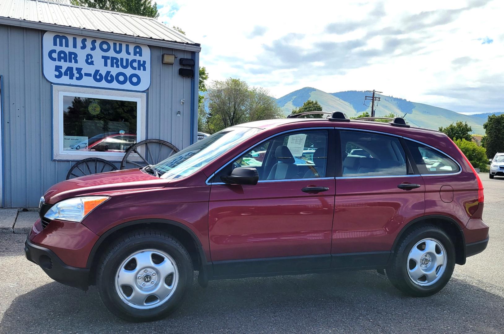 2009 Red /Gray Honda CR-V LX (5J6RE483X9L) with an 2.4L L4 engine, 5 Speed Automatic transmission, located at 450 N Russell, Missoula, MT, 59801, (406) 543-6600, 46.874496, -114.017433 - Great Running AWD SUV. 2.4L I4 Engine. 5 Speed Automatic Transmission. Air. Cruise. Tilt. Power Windows and Locks. New Tires. Roof Rack. Does have a Rebuilt Title so financing is not available. - Photo#0